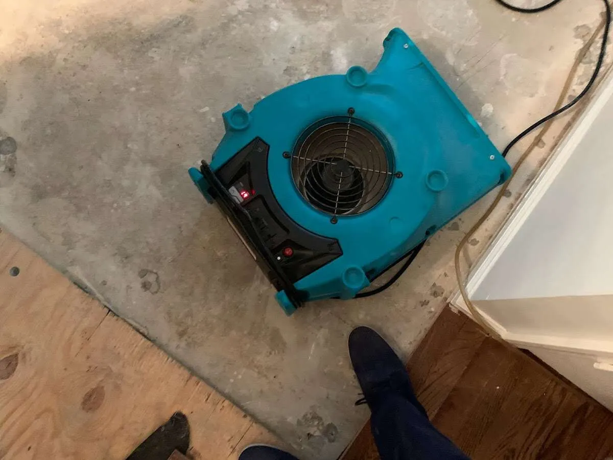 Air mover drying subfloor during Commercial Water Damage Restoration in Village of Oak Creek (Big Park)